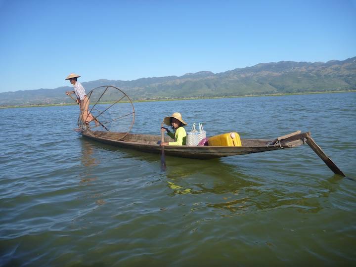Notice the little girl doing the paddling while he fishes from the bow.